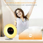 Digital alarm clock with FM radio, gold globe, orange digital time, adjustable volume icon