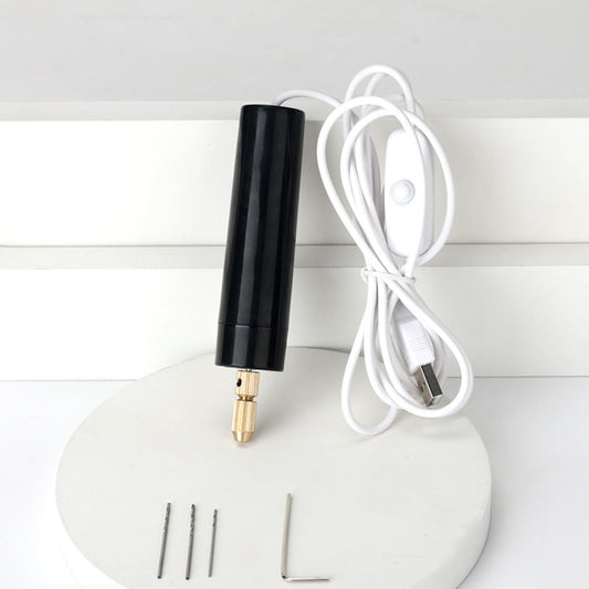 Handheld mini electric grinder with black body, gold tip, white cord, and drill bits