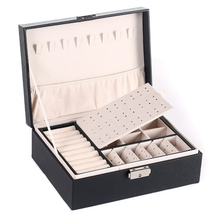 Black jewelry box open with earring slots, lined trays, and front lock clasp