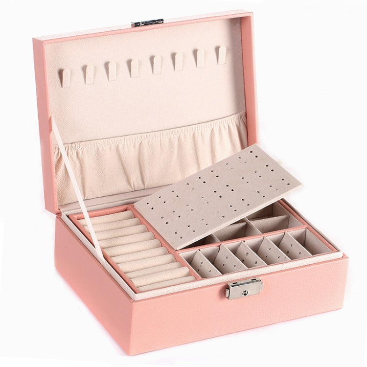 Pink jewelry box open with earring slots, stud tray, and front lock clasp