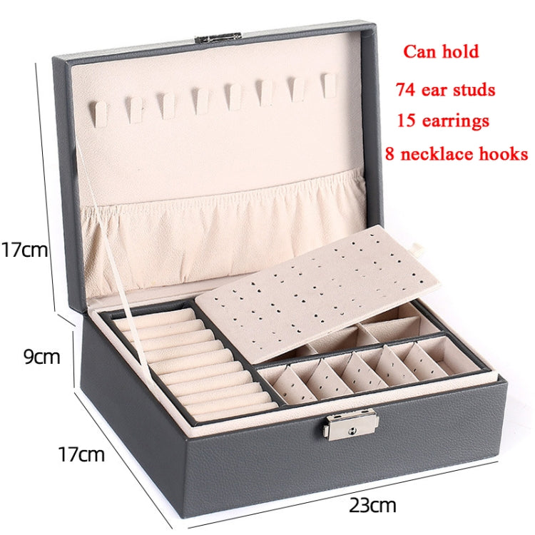 Gray jewelry box open with earring stud rows, necklace hooks area, and lock clasp