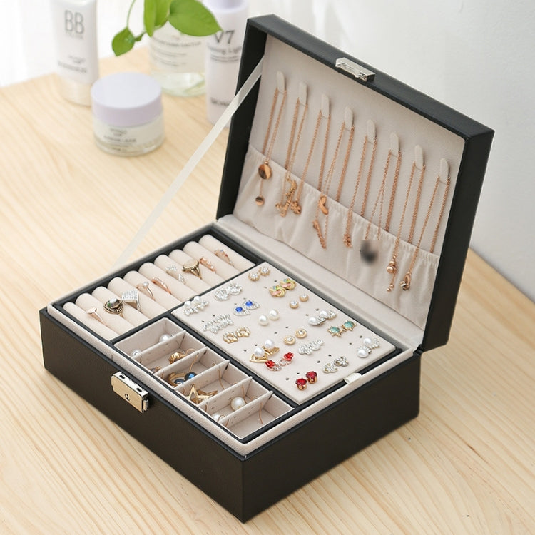 Black double-layer jewelry box with lock, open compartments for earrings and necklaces
