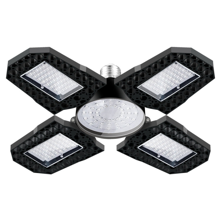 LED plant grow lamp with four square LED panels and round center emitter, black stand