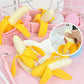 Peeling banana toy with multiple banana pieces and a pink basket/cart display