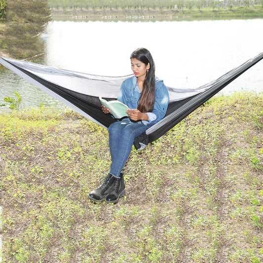 Nylon parachute camping hammock in black and gray, open fabric with hanging ends