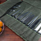 Olive green canvas knife storage roll bag with multiple knives in stitched pockets