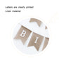 Close-up burlap triangle birthday flags with printed white letter “BI”