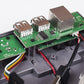 Raspberry Pi board installed in case, showing USB connectors and wiring