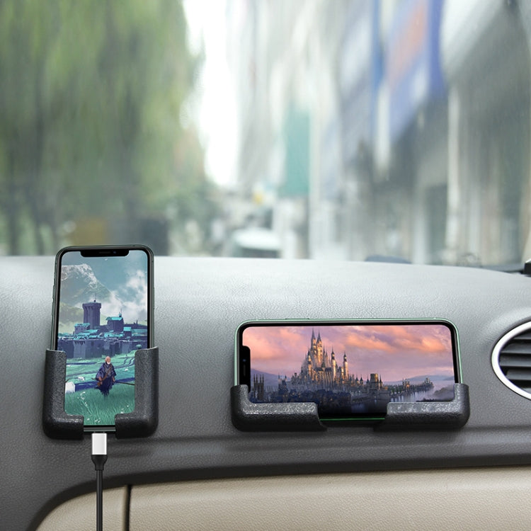Car dashboard phone holder set with two black U-clips holding phones