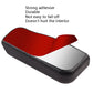 Adhesive-backed phone holder clip with black textured surface and backing