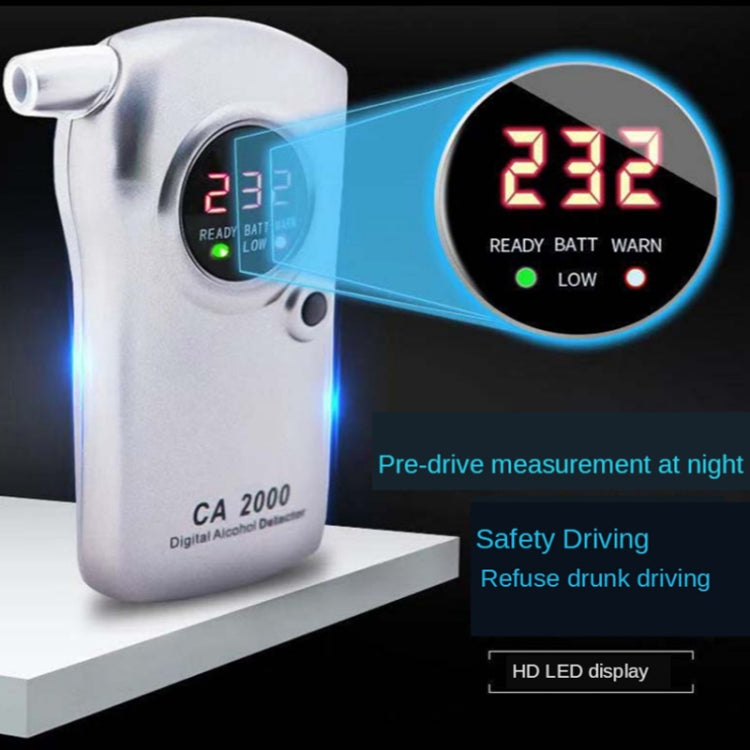 Handheld alcohol tester with illuminated screen showing red numeric reading