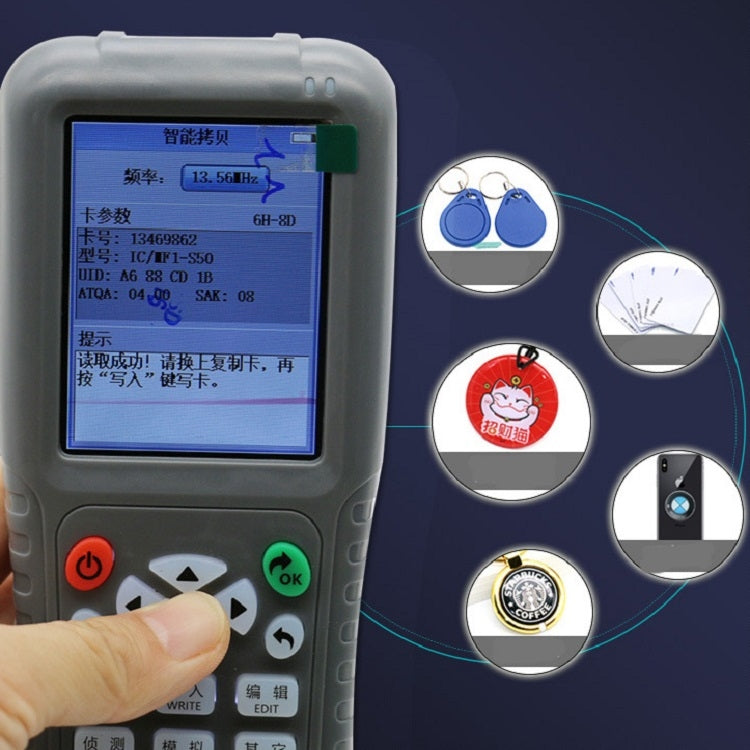 Close-up of handheld card duplicator screen with navigation buttons and status prompts