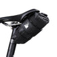 Black bicycle saddle tool bag mounted on a bike saddle with attached side pouches
