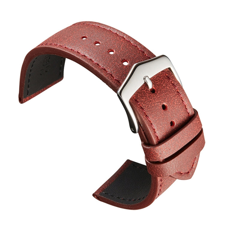 Red cowhide leather watch strap with broken texture, silver buckle and pin holes