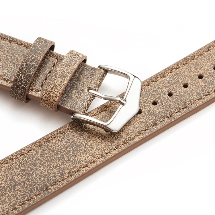 Textured light brown watch strap with silver buckle and leather keeper loops
