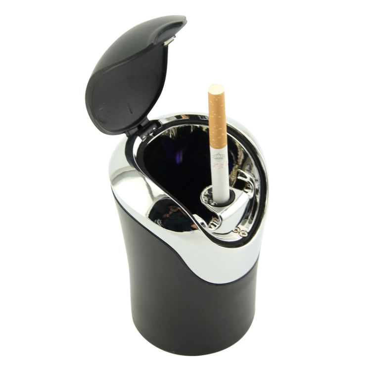 Mini car ashtray with open hinged lid and built-in lamp slot