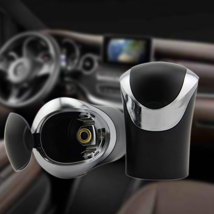 Mini car ashtray with open lamp cup and hinged cover on dashboard