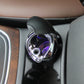Mini ashtray with open lid and purple-lit inner lamp