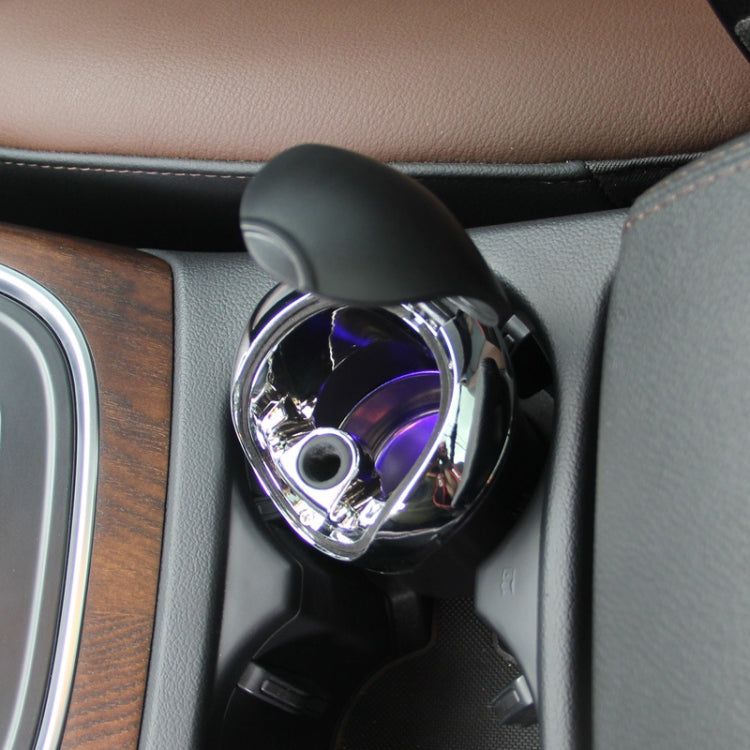 Mini ashtray with open lid and purple-lit inner lamp