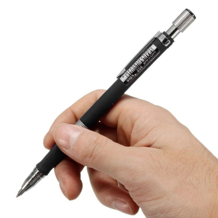 Black automatic mechanical pencil held in hand with metal push-out lead tip