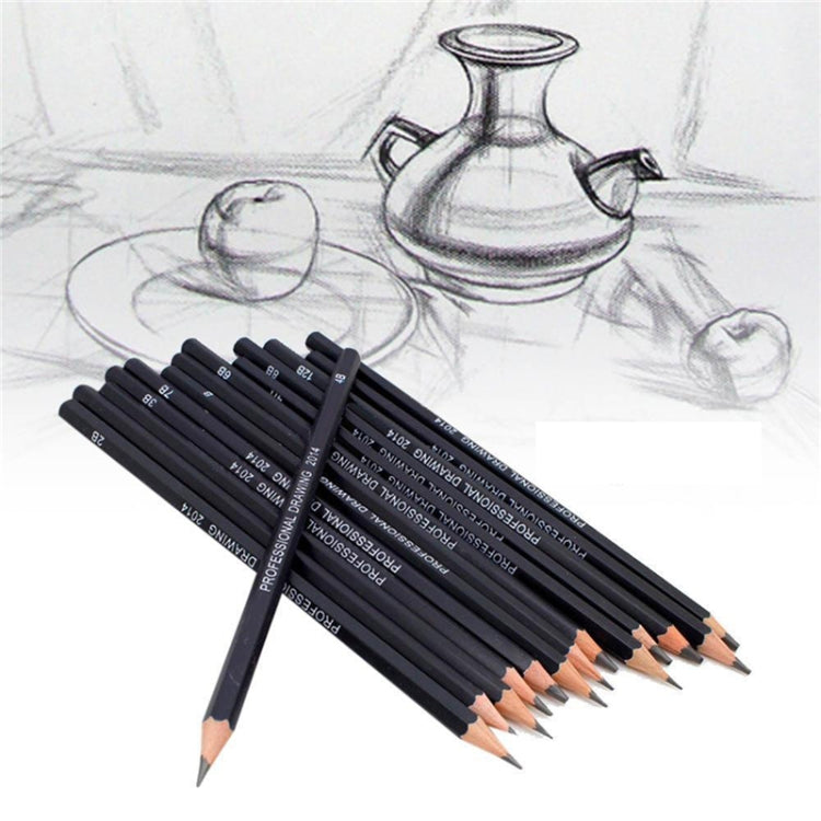 Graphite sketching pencil set angled on paper, dark pencils with sharpened graphite tips.