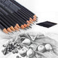 Close-up of graphite sketching pencils, dark barrels, light tips, labeled with grade marks.
