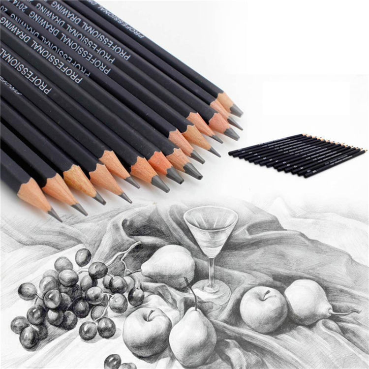 Close-up of graphite sketching pencils, dark barrels, light tips, labeled with grade marks.