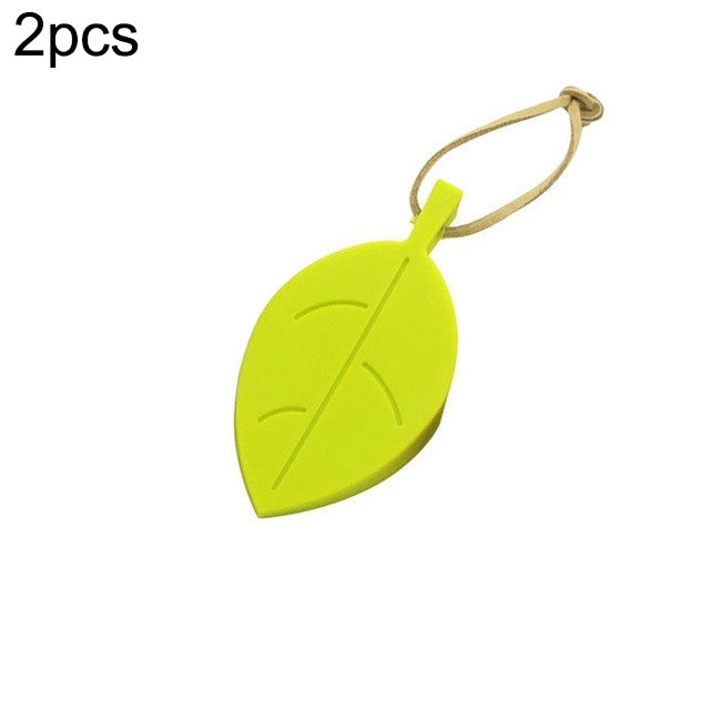 Lime green silicone leaf door stop with beige anti-pinch cord loop