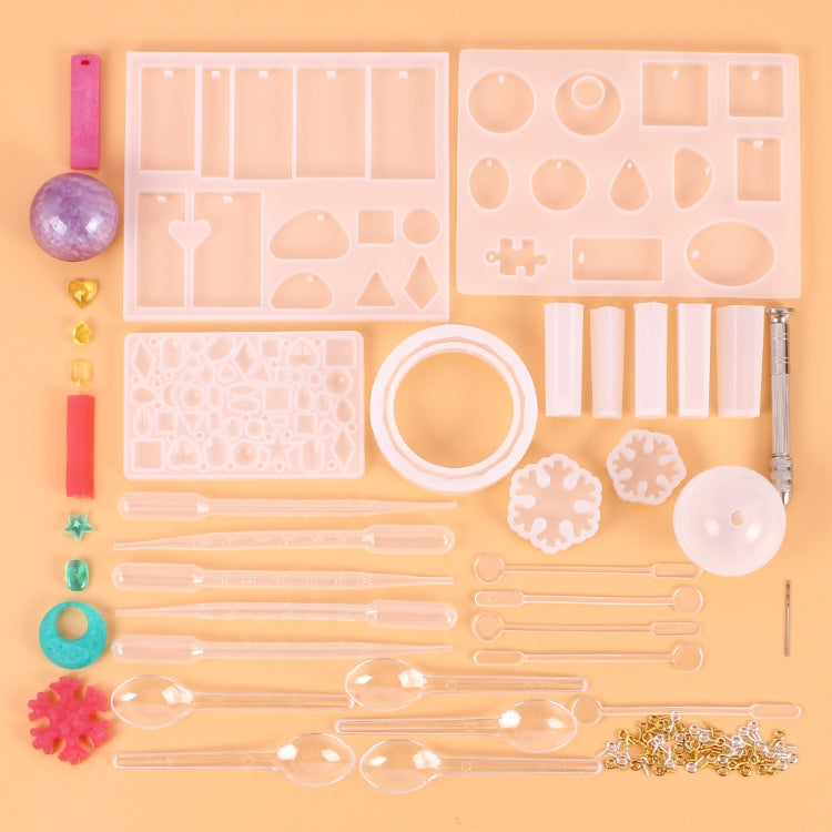 Silicone pendant mold set with assorted cavities, droppers, sprue rods, and chain parts