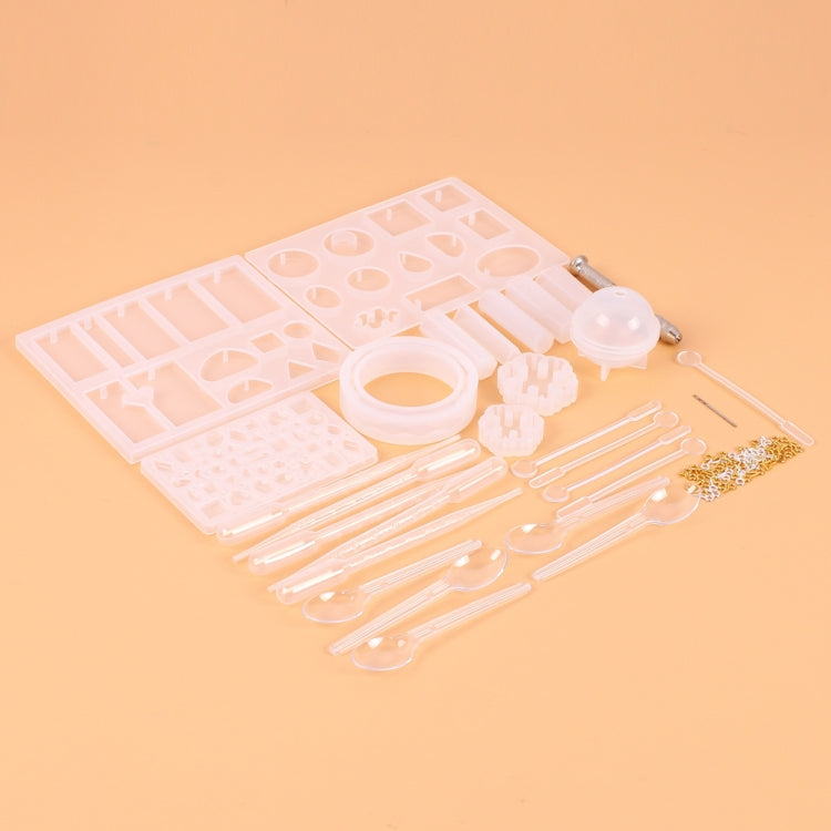 Silicone pendant mold set with multiple trays, drip rods, and small accessory parts