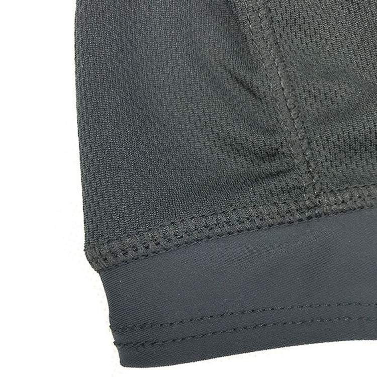 Black fabric helmet liner cap with stitched hem and textured weave