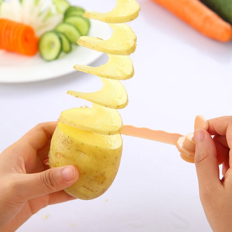 Carrot spiral slicer creating spiral vegetable curls held by hands