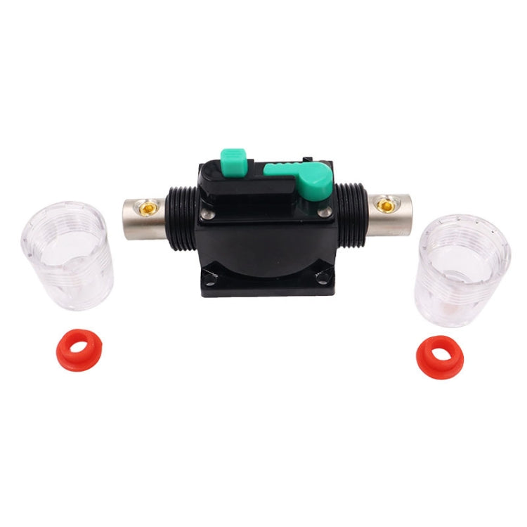 Circuit breaker switch with green lever, black housing, clear end caps and mounting ports