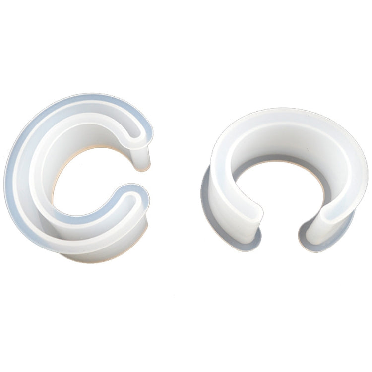 Two white C-shaped silicone bracelet half-opening molds for DIY crafting