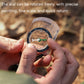 2-in-1 outdoor compass close-up, dial adjusted by fingers; clear body