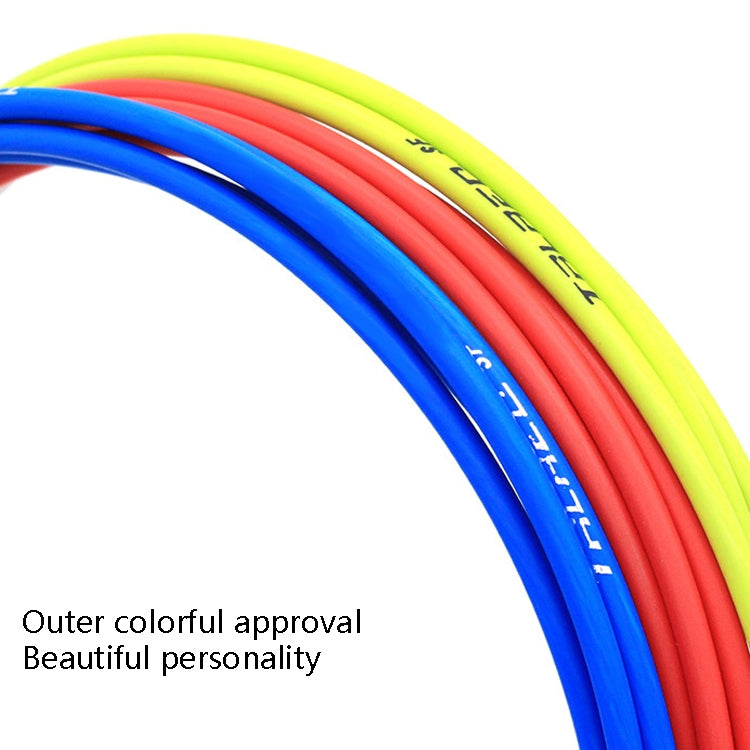 Curved colorful bicycle line tubes close-up with red, blue, and neon green coils