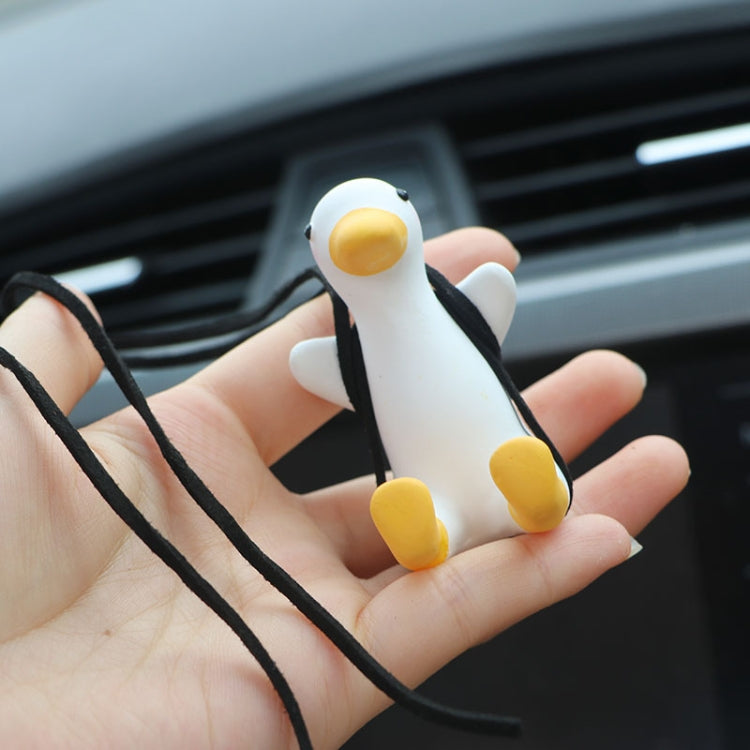 White duck car pendant with yellow beak and feet, held on two black cords