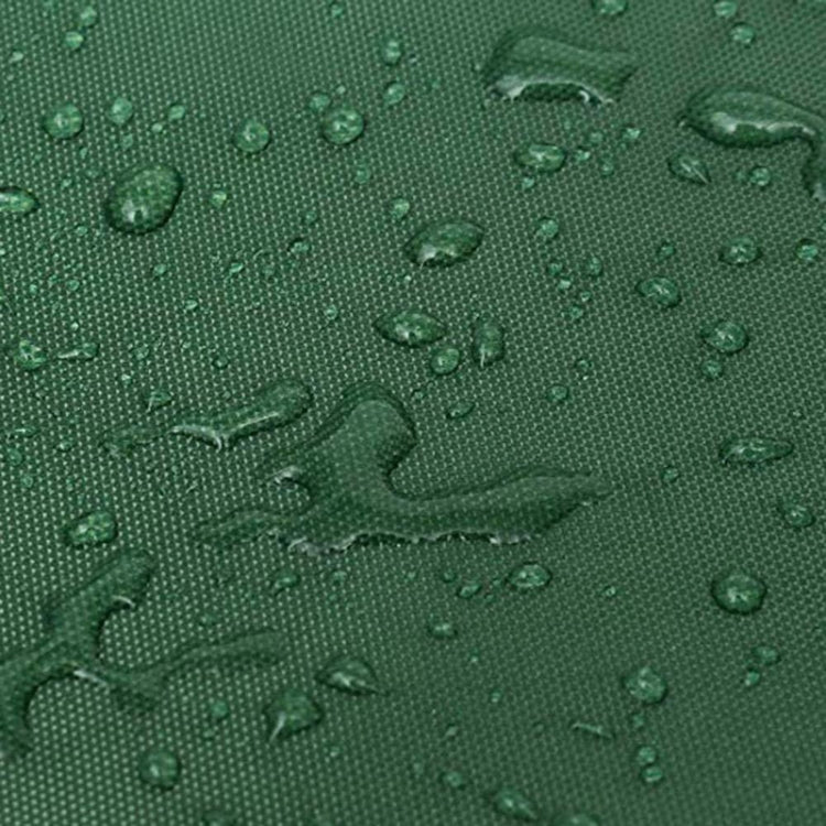 Green textured fabric surface with water droplets for outdoor protective cover