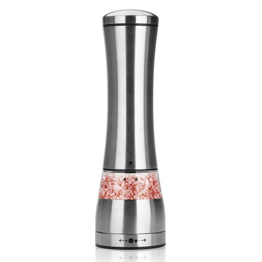 Stainless steel manual pepper grinder with adjustable base and visible pink seasoning