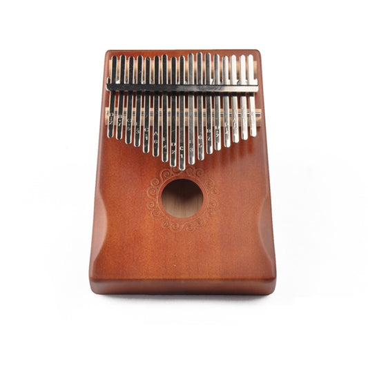 Brown 17-key wooden kalimba thumb piano with round sound hole and metal tines