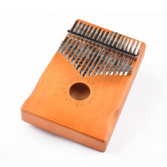 Orange-toned 17-key wooden kalimba thumb piano with metal tines and round sound hole