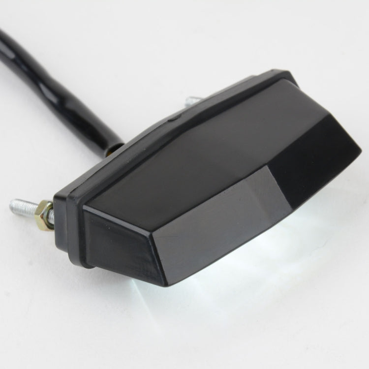 Motorcycle LED license plate taillight light, black rectangular side housing with screws