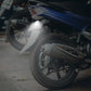 Motorcycle LED license plate taillight mounted on bike, emitting bright white light
