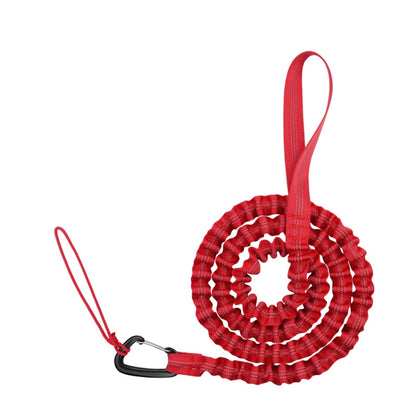 Red coiled bicycle tow rope with loop handle and carabiner end
