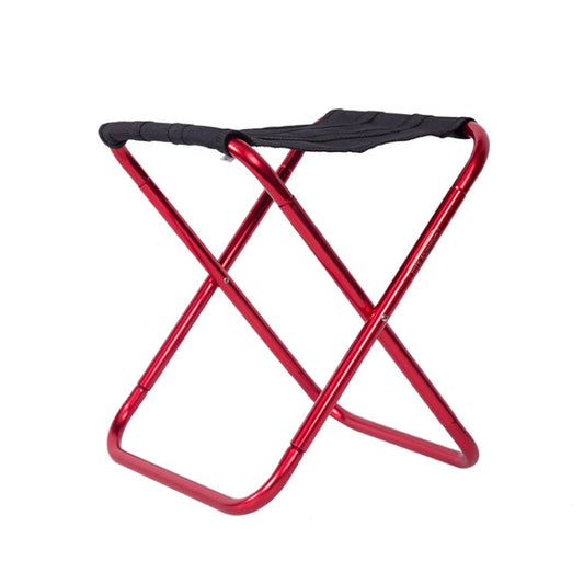 Red folding camping chair with black fabric seat and cross metal legs