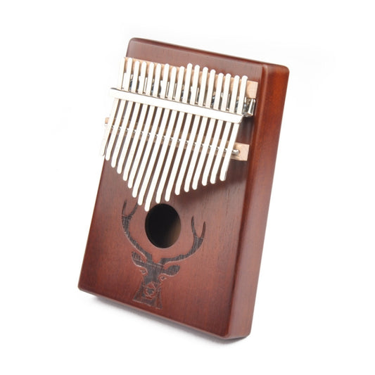 Deer head kalimba thumb piano with 17 metal tines on a wooden brown body