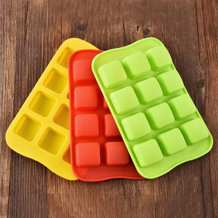 Stacked silicone cube molds in yellow, red, and green with rectangular cavities