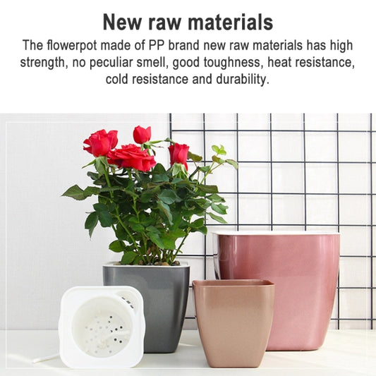 Metal-look plastic flowerpots set in dark gray, rose-pink, and tan with plants