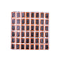 Square tire repair patch sheet with 48 black-and-orange square pads