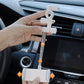 Car dashboard phone bracket clip with silver rod and white phone holder